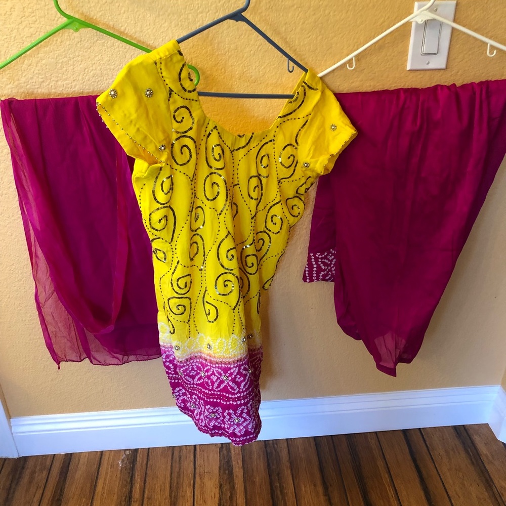 Beautiful pink and yellow Indian pants and shirt.